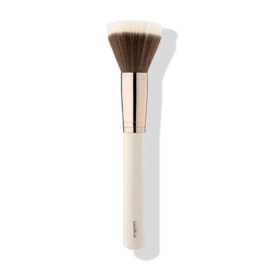 a makeup brush with a white handle