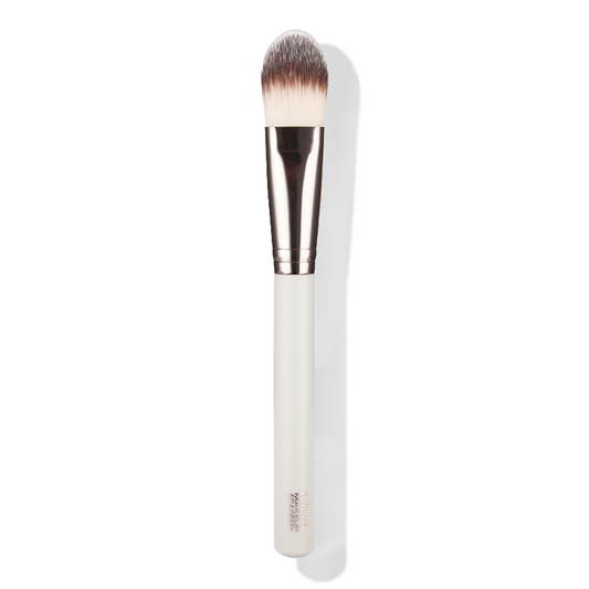a white brush with a white handle