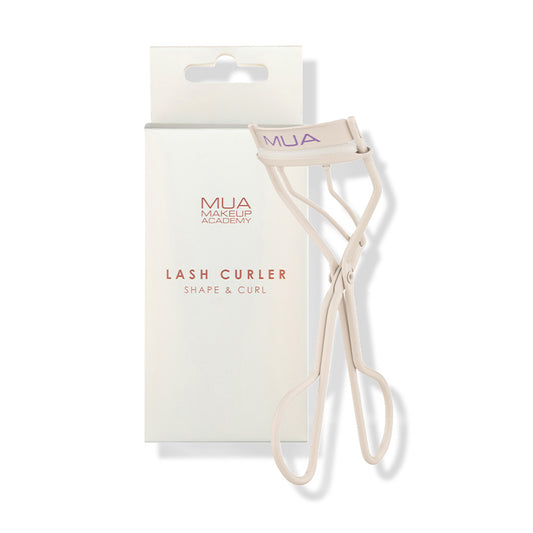a white eyelash curler with a box