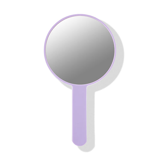 a round mirror with a handle