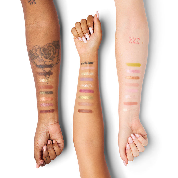 a group of people with different colors of makeup on their hands