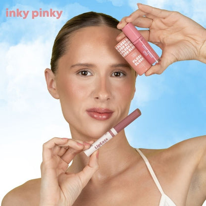 a woman holding a lip gloss