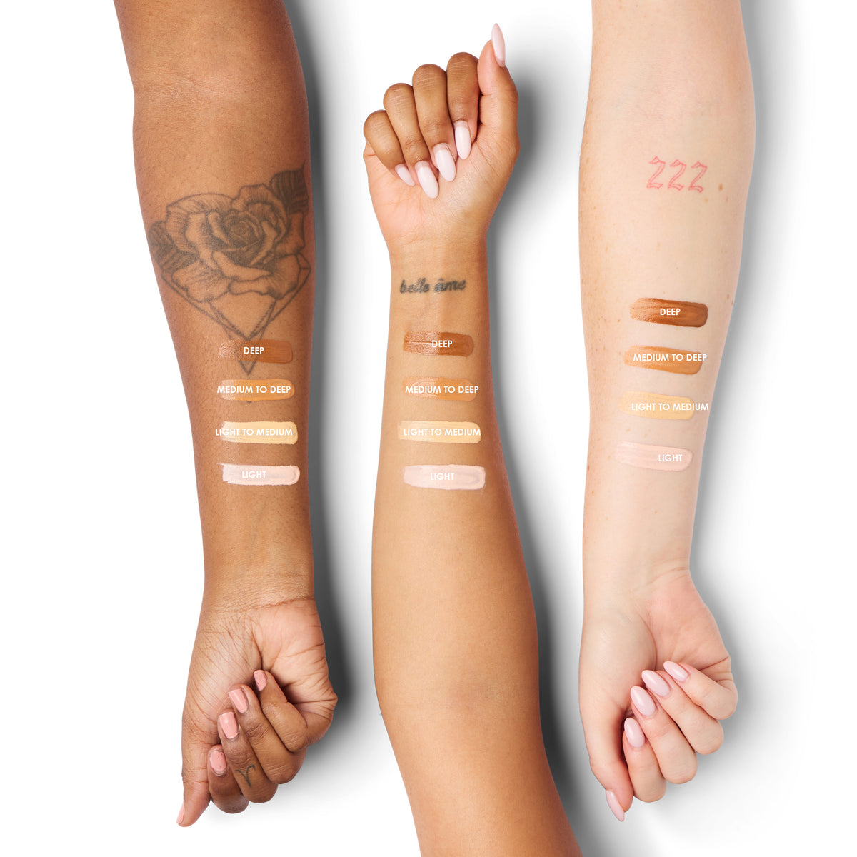 a group of people with different skin shades on their arm