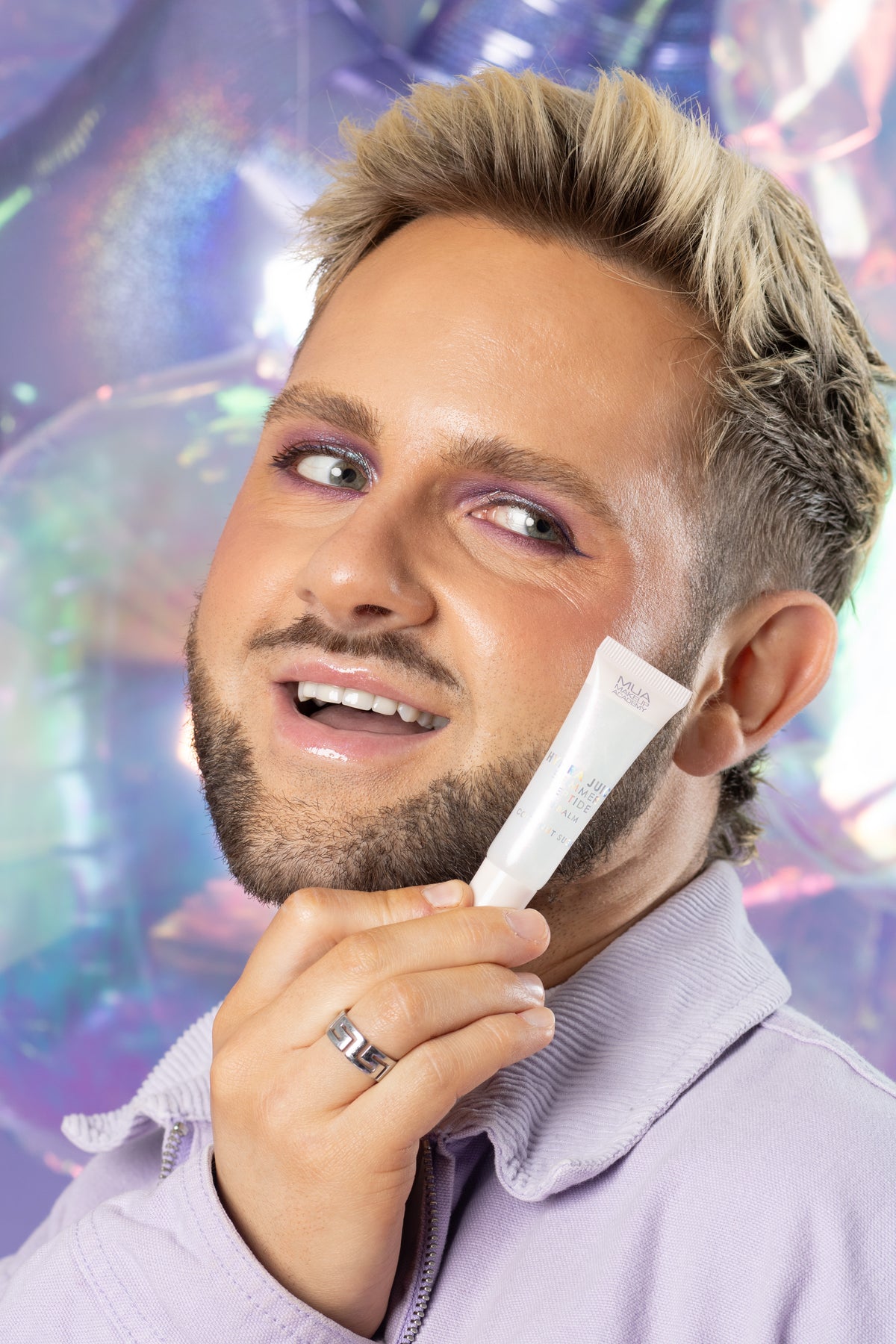 a man holding a tube of cream