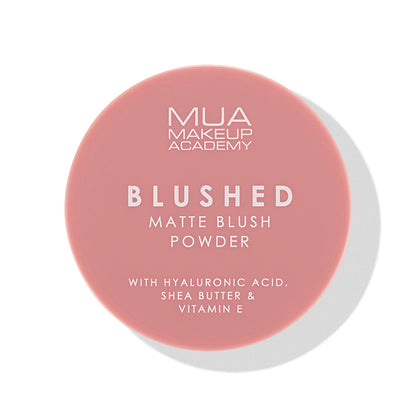 a pink round container with white text