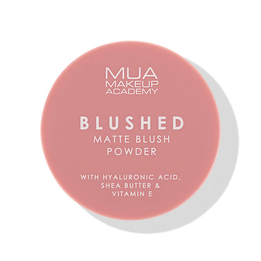 a pink round container with white text