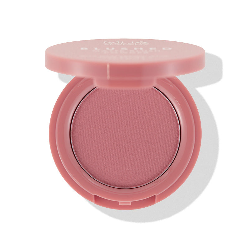 a pink eye shadow in a round container