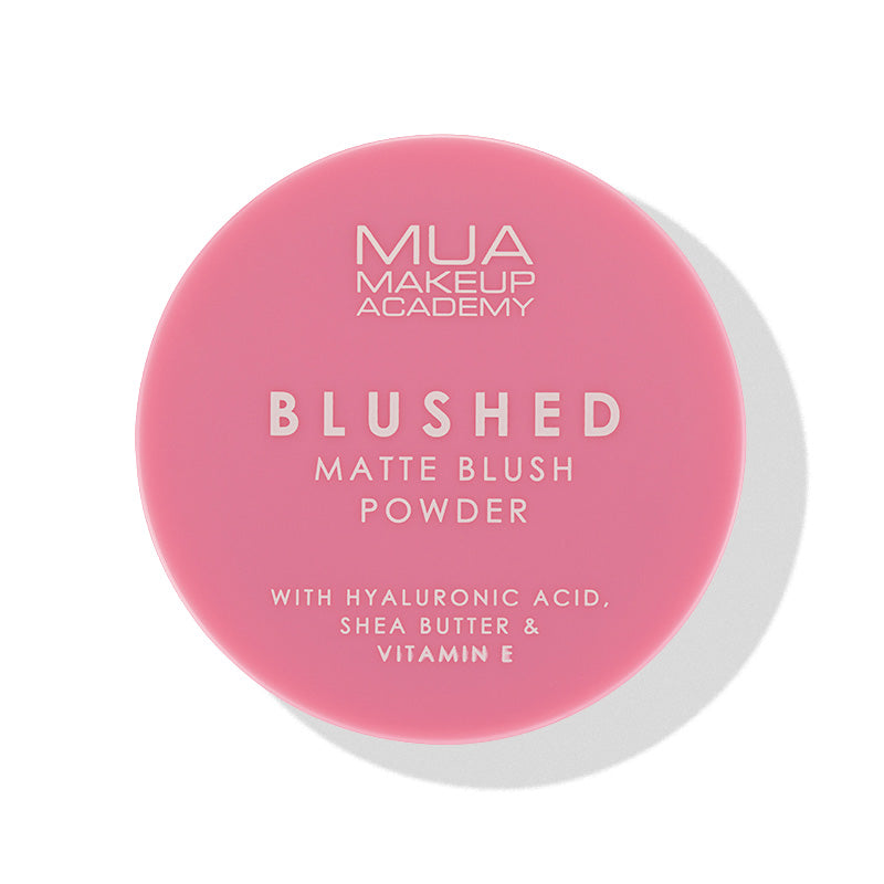 a pink round container with white text