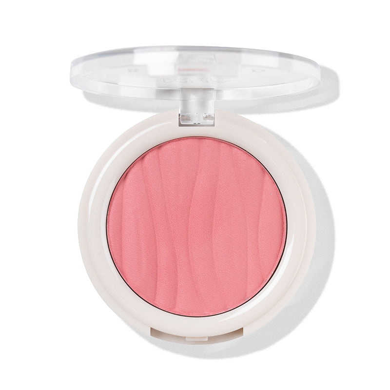 a pink blush in a white container