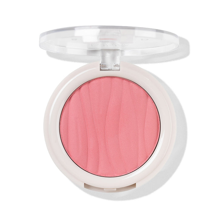 a pink blush in a white container