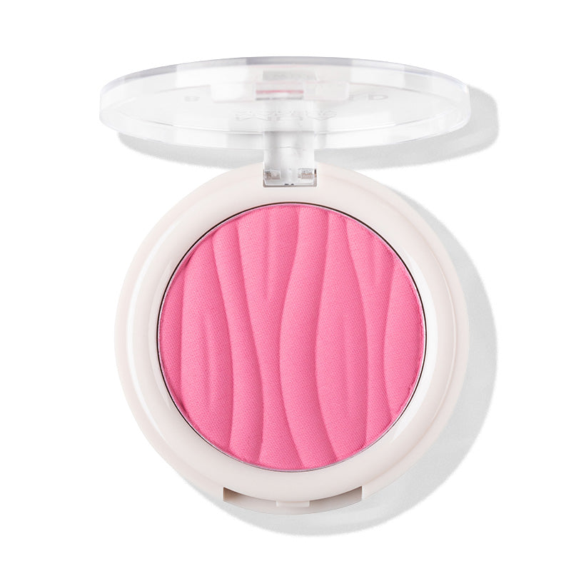 a pink powder in a white container