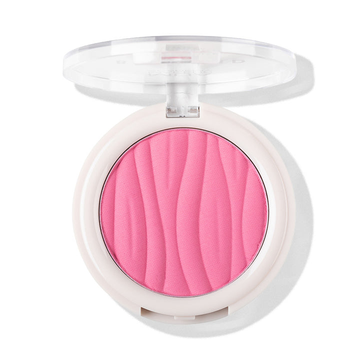 a pink powder in a white container