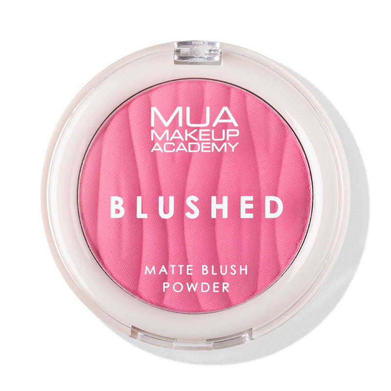 a pink powder in a white container