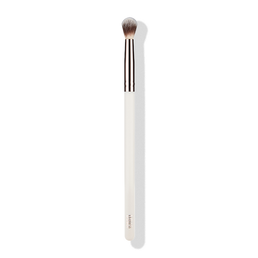 a white brush with a white handle