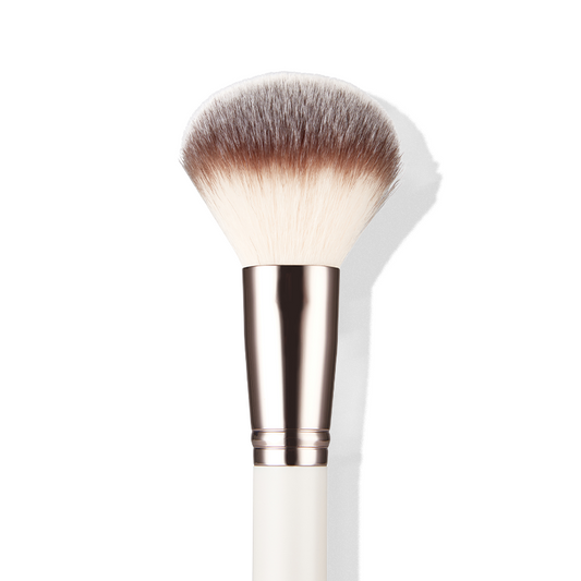a close up of a makeup brush