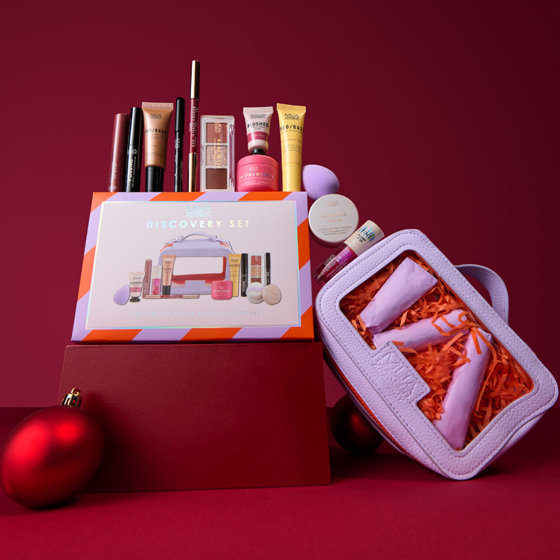 a group of makeup products and a bag