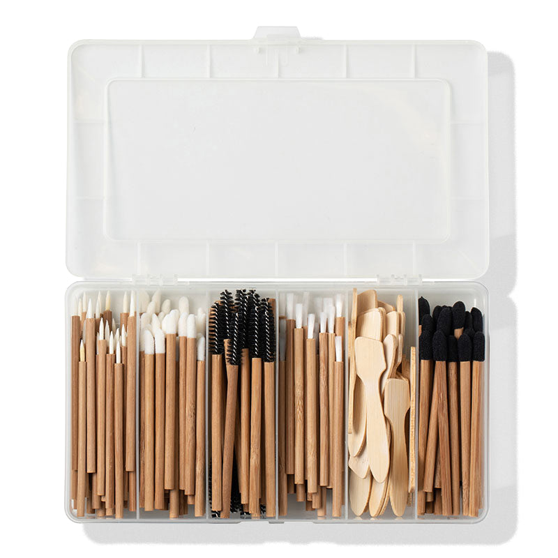 a plastic container with a variety of wooden objects