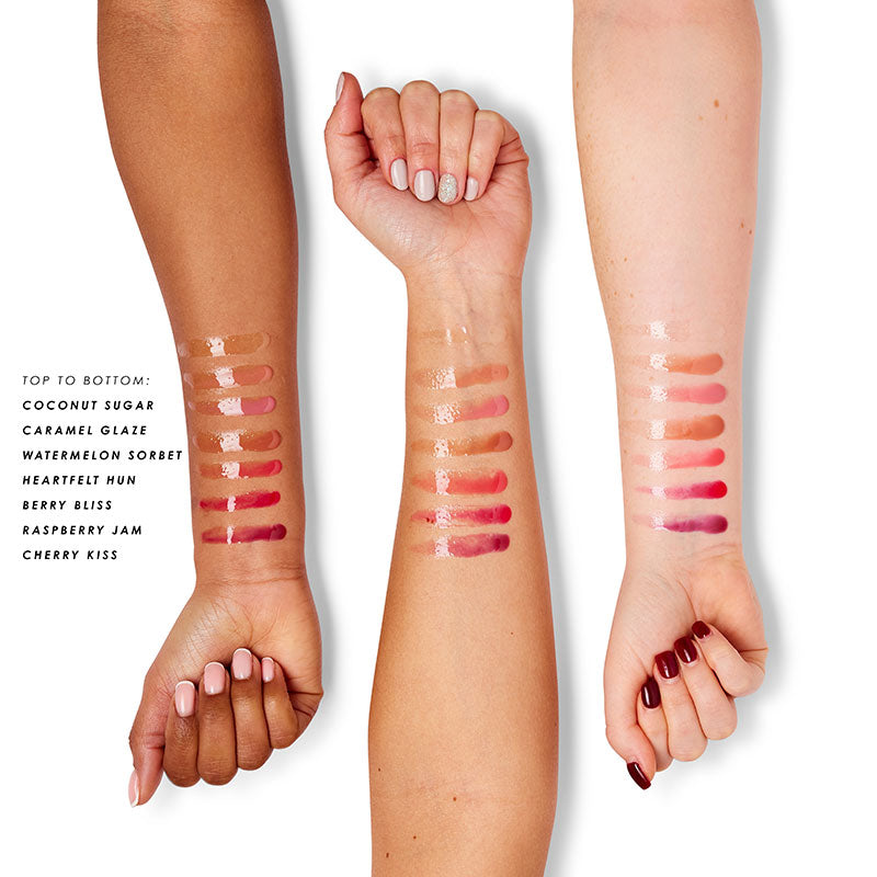 a woman's hands with different shades of lipstick