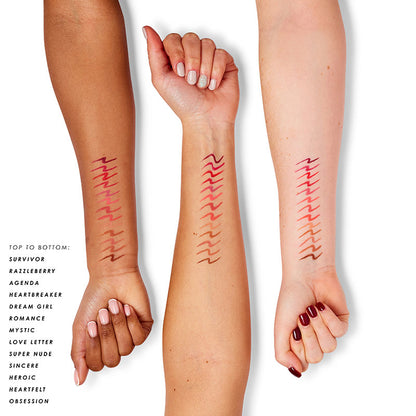a woman's hands with different colors of lines on their arm