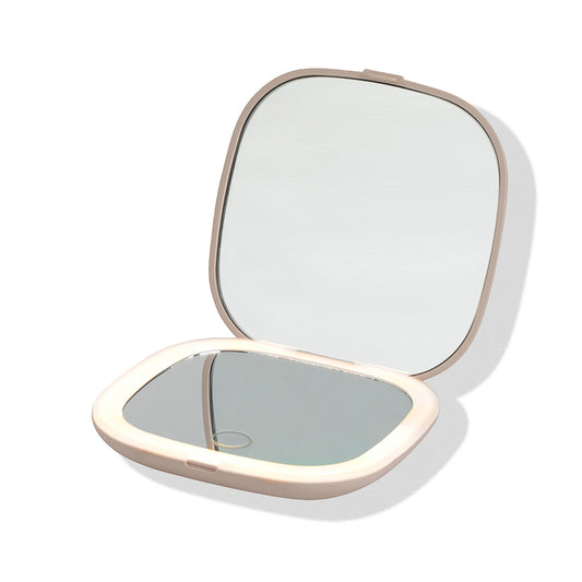 a small mirror with a white border