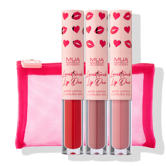 a group of lipsticks in a pink case
