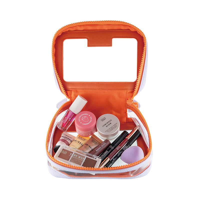 a small orange bag with various makeup products