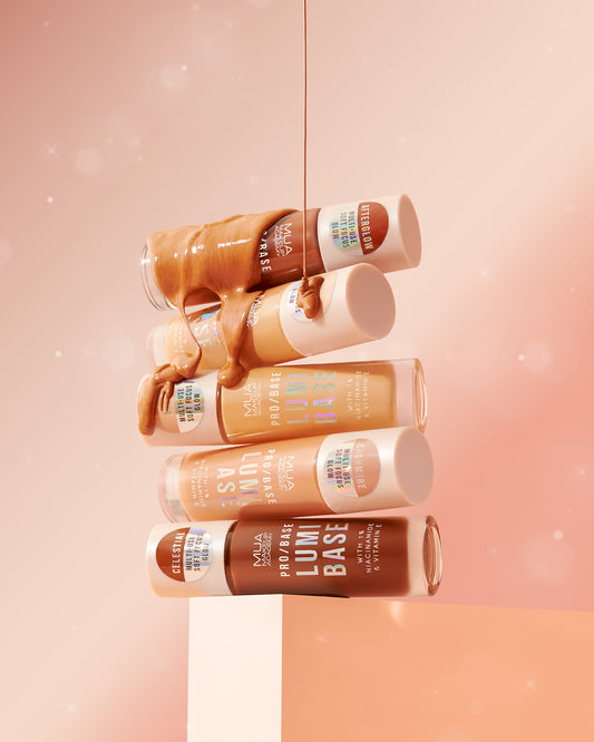 a group of liquid foundation on top of a box