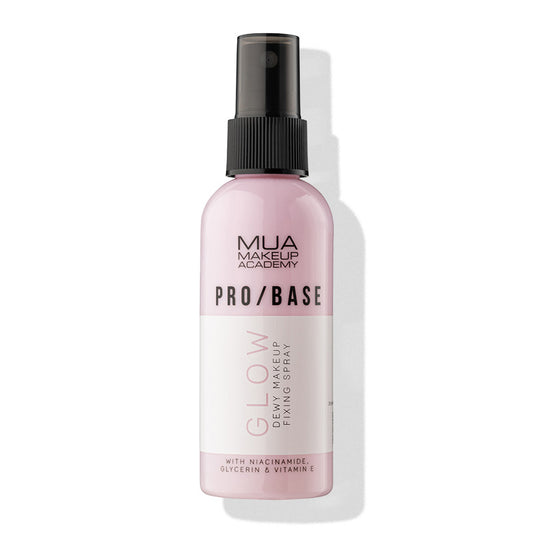 a pink spray bottle with a black cap