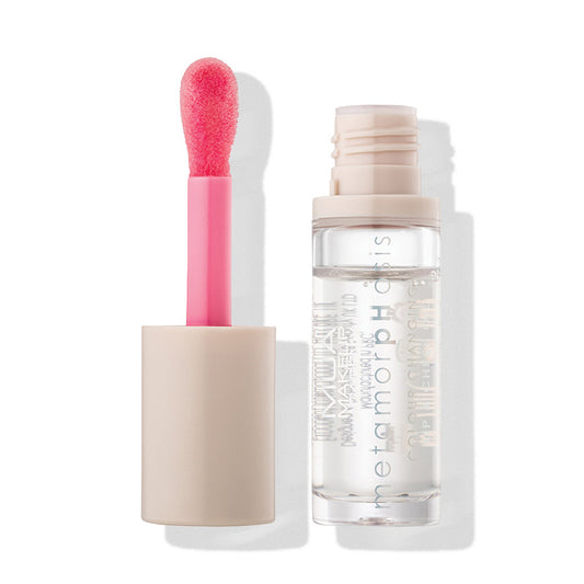 a pink lip gloss and a small bottle