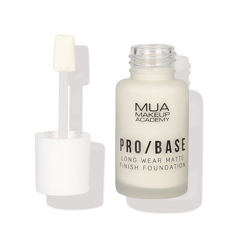 a white bottle with a brush