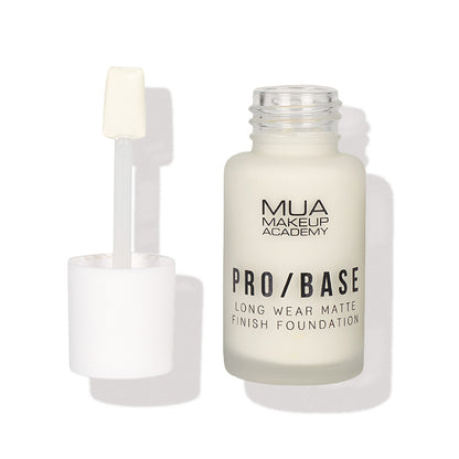 a white bottle with a brush