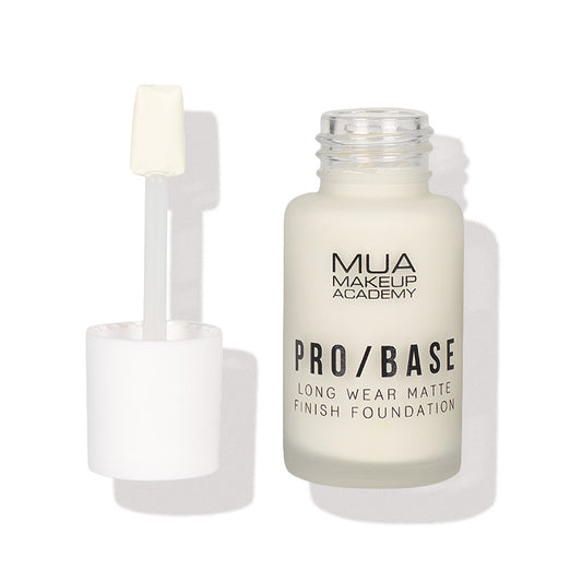 a white bottle with a brush