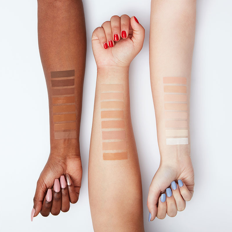 a group of people with different skin shades on their hands