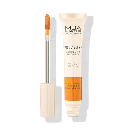 a tube of makeup and a brush