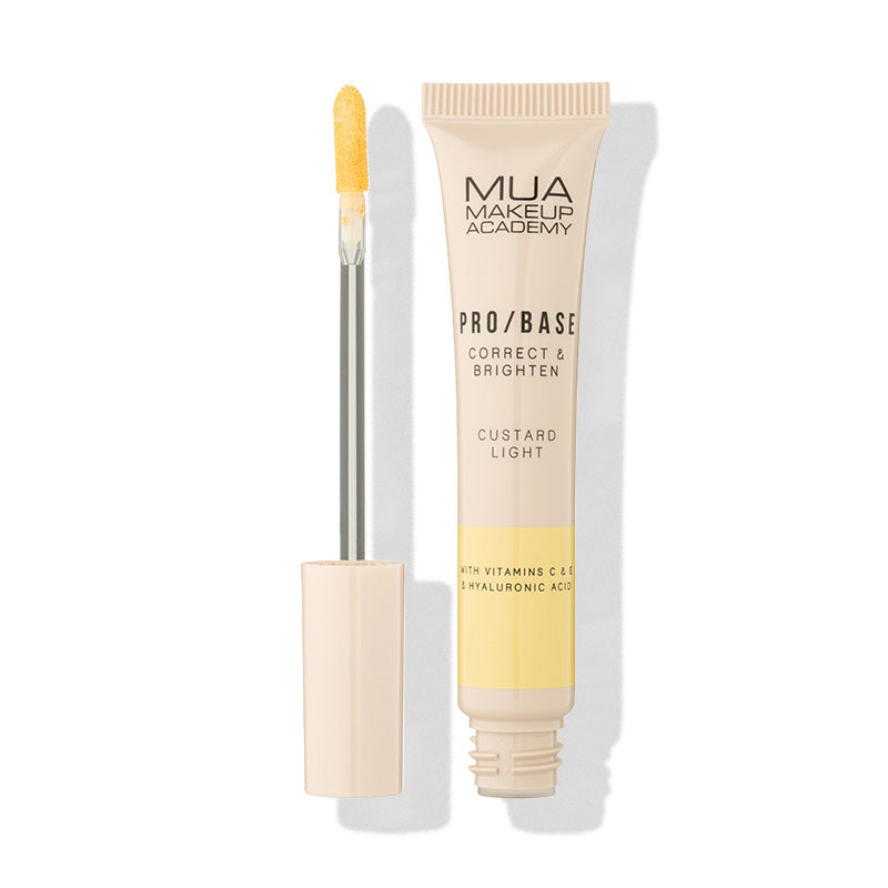 a tube of makeup and a brush