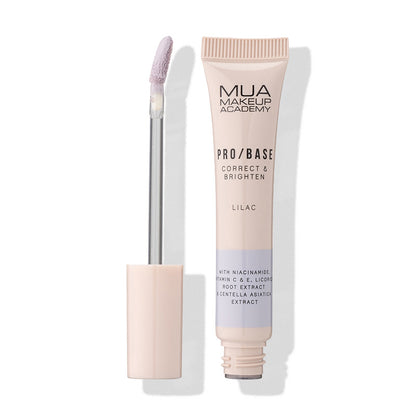 a tube of makeup and a brush