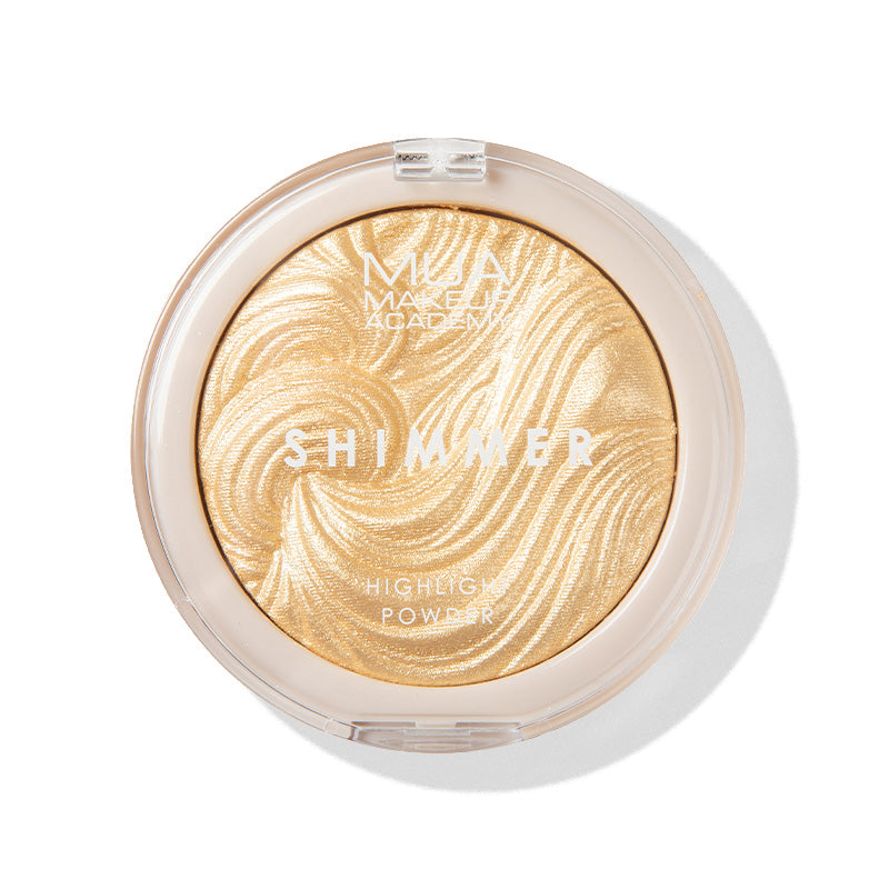 a round container with a gold powder in it