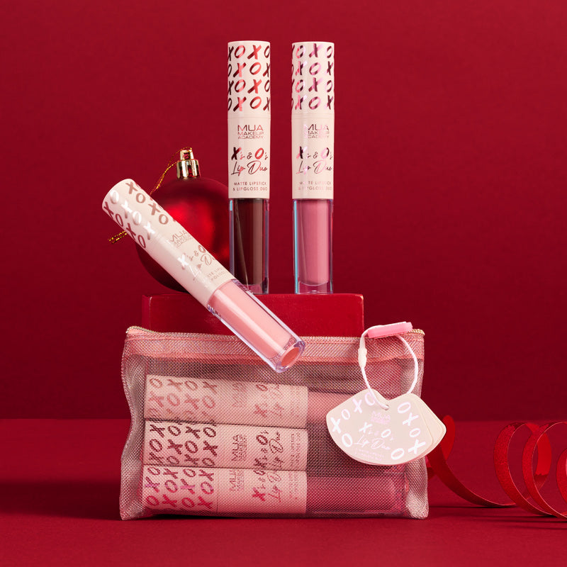 a bag of lip glosses and a red ball